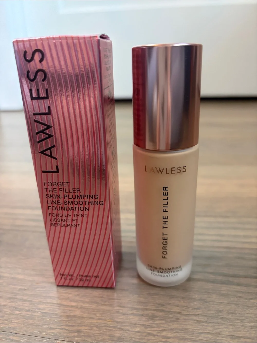 LAWLESS Foundation Bottle in Light Beige with Rose Gold Cap